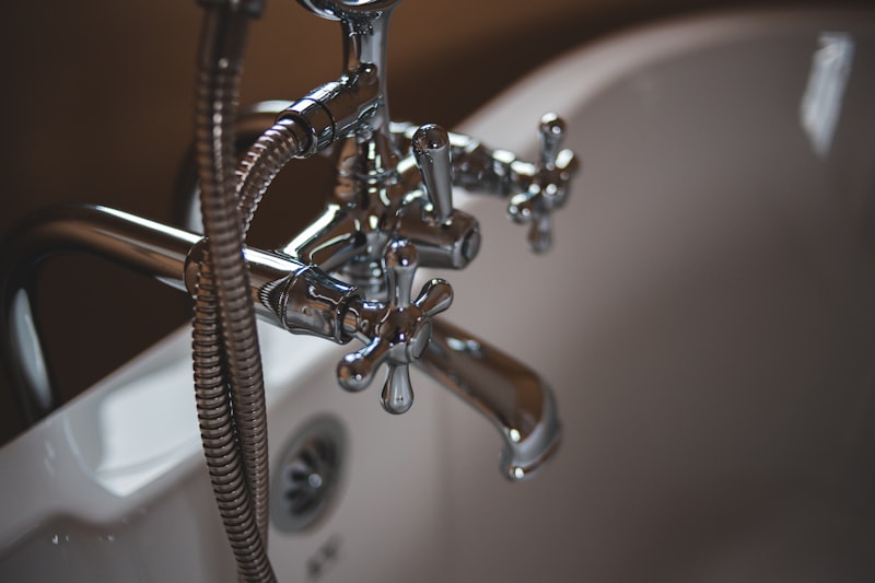 Polished chrome tub faucet and fixture installed by BluePipe